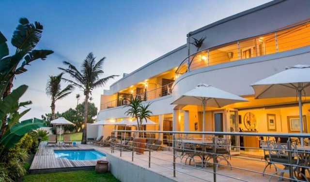 Vetho House and pool at dusk