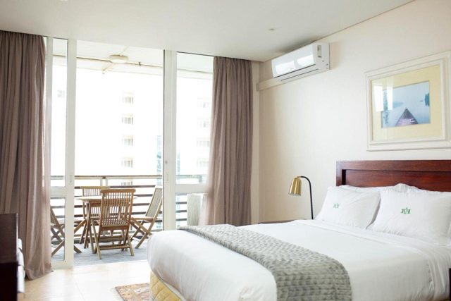 Bedroom with doors to the balcony