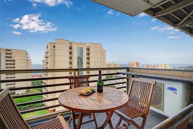 Balcony with a table and chairs