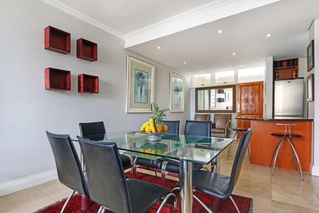 Dining table in front of the kitchen