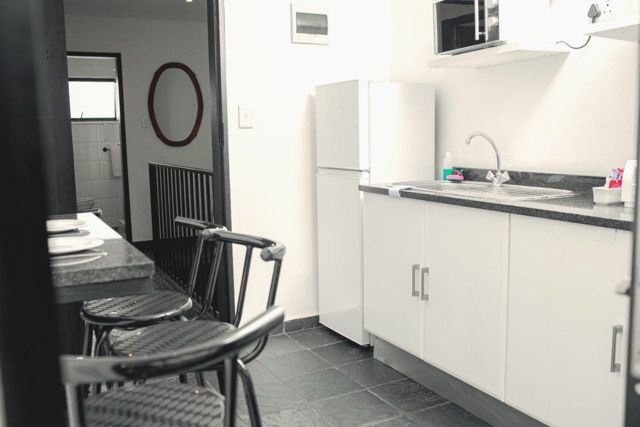 Kitchenette with fridge and dining area