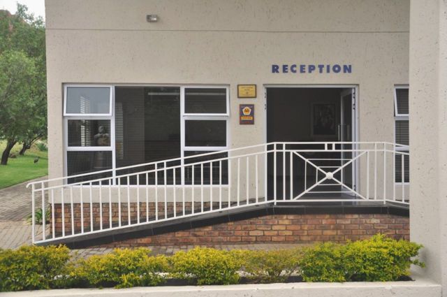 Entrance to the reception building at Vetho 2, with a ramp and handrails